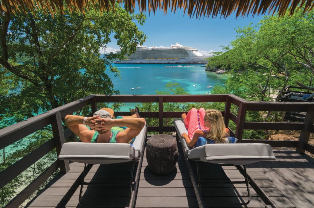 AL, May 2017 Instameet shoot, Labadee, Haiti, Private Island, Private Beach, Private Cabana, Relaxation, Caribbean, POV from cabana, view through trees of ship, Allure of the Seas, couple relaxing in lounge chairs,